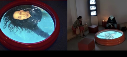 Pool Currents installation with projected swimmers in a water-filled pool
