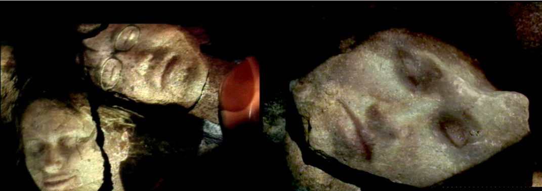 Rocks installation with faces projected onto stones